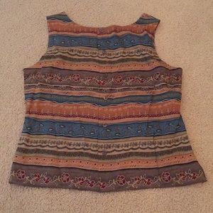 Suit with wrap around button skirt.